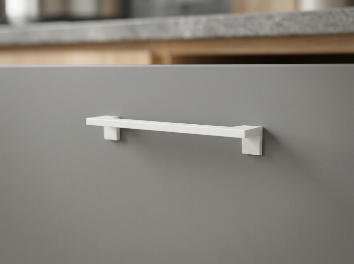 DH007 matt white angular bar handle fitted to a grey slab kitchen drawer front