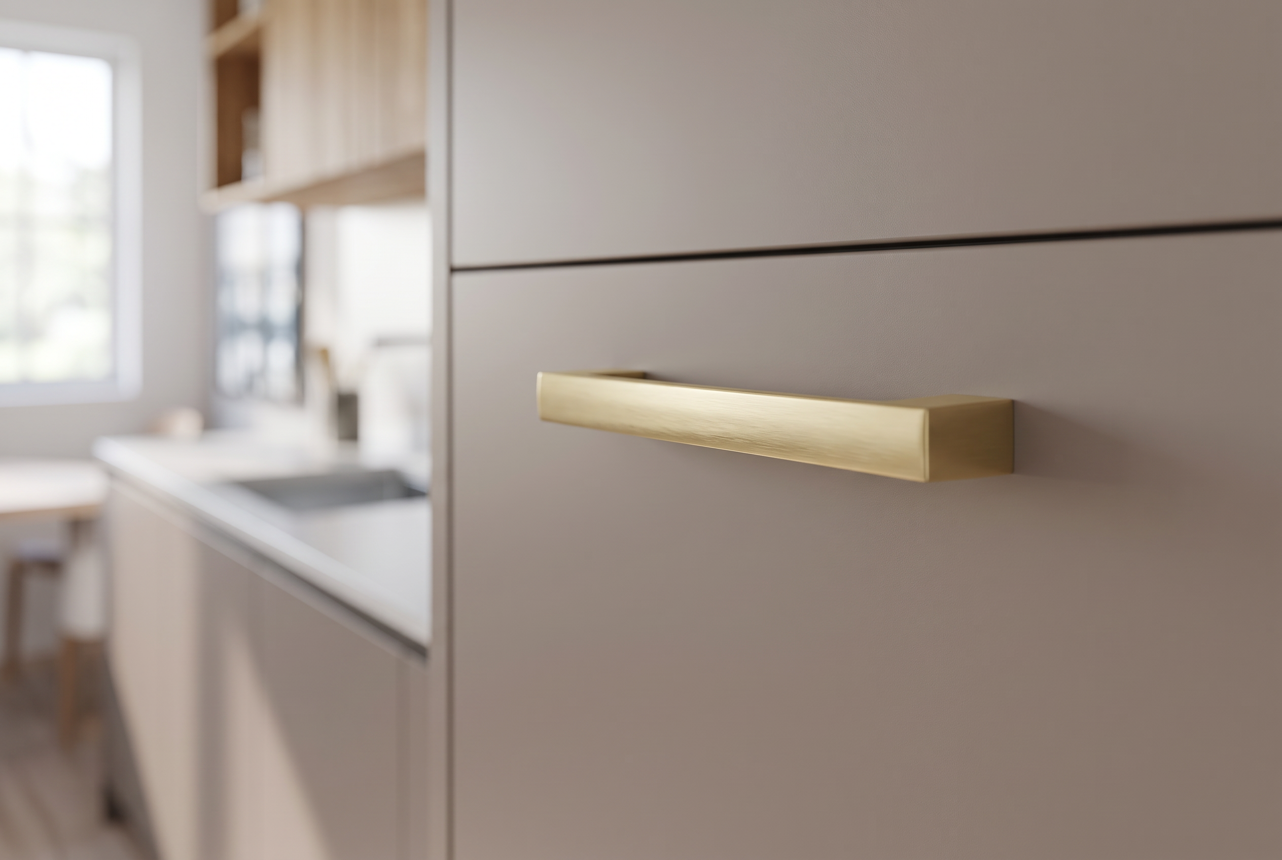 DH017BB satin brass slim bar handle fitted to a taupe slab drawer front