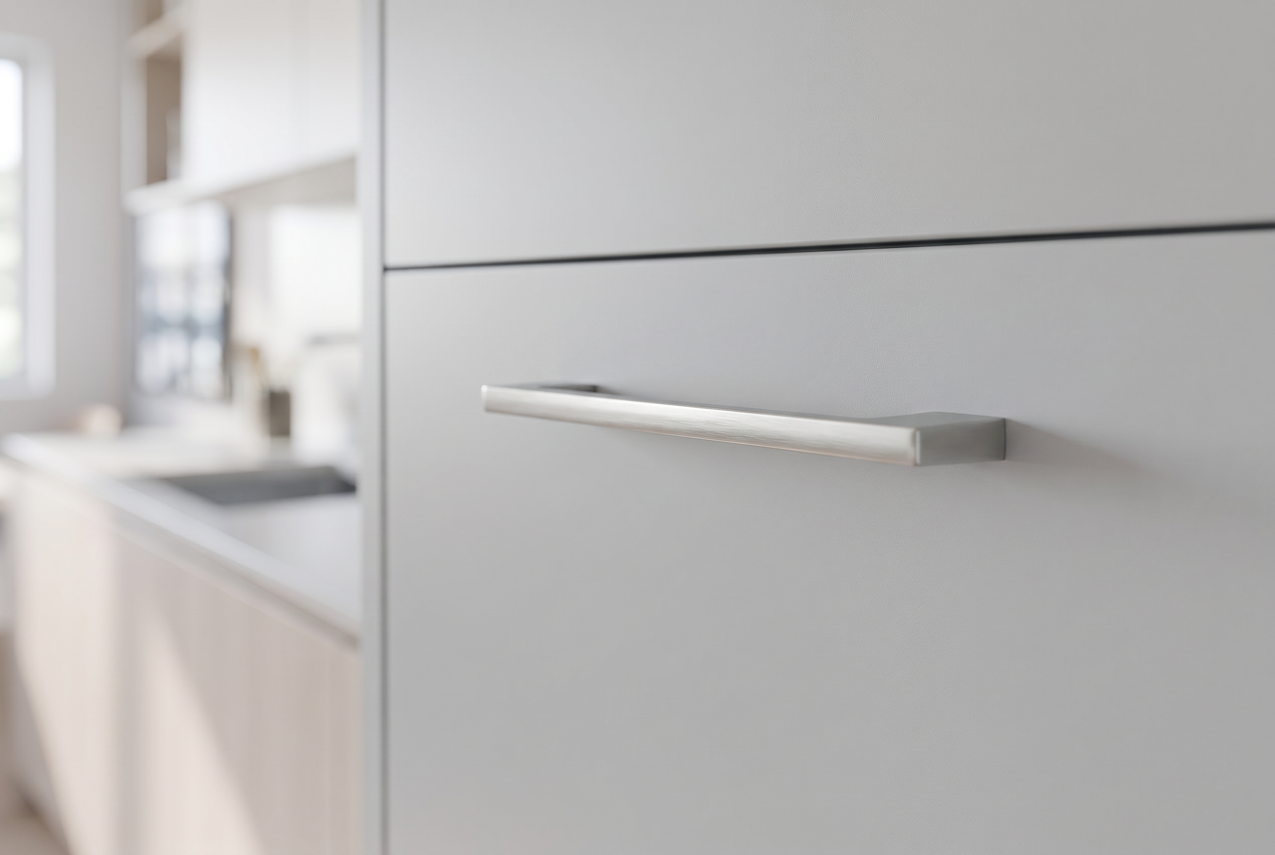 DH017BSN brushed nickel slim bar handle fitted to a pale grey slab door